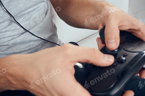 Preview: Gamepad male hands close-up video game addiction office technology