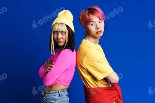 Preview: Asian couple with multicolored hair posing back to back