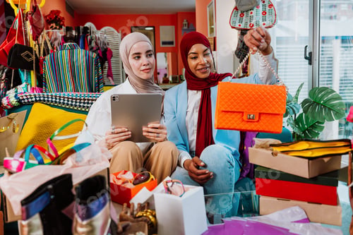 Preview: Muslim women reviewing fashion accessories for online business