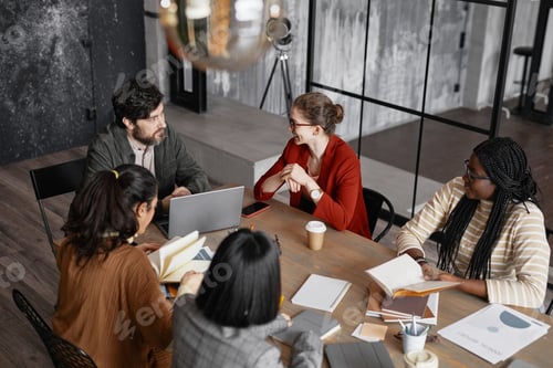 Preview: Business People Collaborating in Grey Office