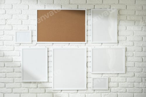 Preview: Varied Sized Photo Frames Displayed on a White Brick Wall