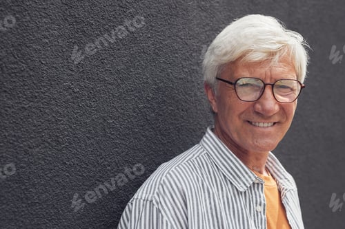 Preview: Portrait of Smiling Mature Man on Grey