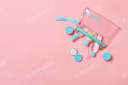 Preview: Top view of means for face care: bottles and jars of tonic, micellar cleansing water, cream