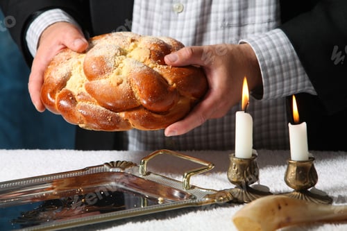 Preview: Heap of sweet round sabbath challah bread black sesame seeds in vintage metal bowl and on small