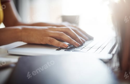 Preview: Cropped shot of an unrecognizable female designer working in her home office