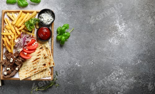 Preview: meat dish kebab with potatoes and sauces