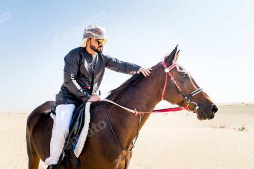 Preview: Arabian man with horse in the desert