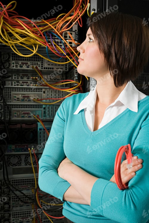 Preview: Woman confidently standing in a server room