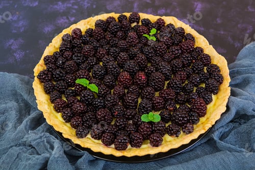 Preview: Delicious tart with blackberries on dark background