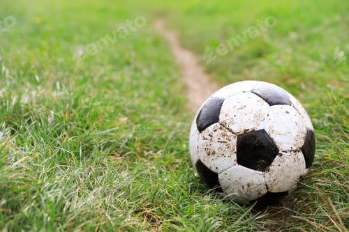 Preview: Dirty soccer ball on green grass outdoors, space for text