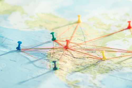 Preview: Selective focus of push pins and strings on world map