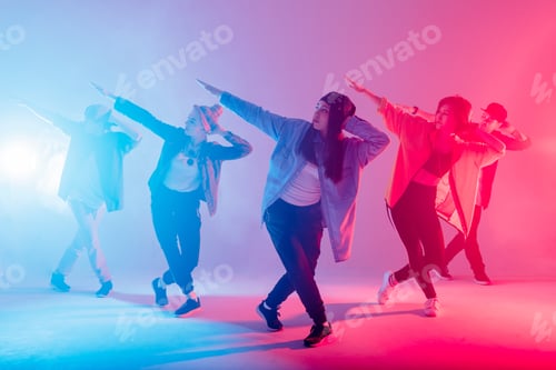 Preview: Group of diverse young hip-hop dancers in studio with special lighting effects