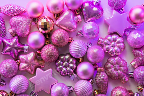 Preview: Christmas decoration balls different shapes in neon rays. Top view. Xmas.