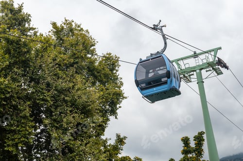 Preview: Funchal cable car cabin going up the mountain from the beach, a cloudy summer day. Madeira