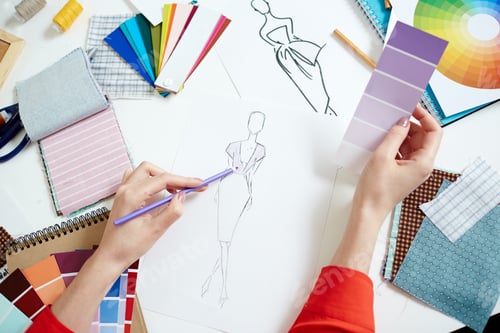 Preview: Fashion Designer Creating Sketches with Color Swatches