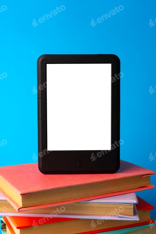 Preview: Modern e-book on stack of hardcover books on blue background