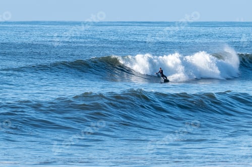 Preview: Man surfing atlantic ocean waves