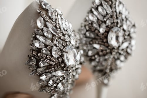 Preview: close up of bride's shoes with jewellery. bride's morning. stylish wedding shoes with jewels.