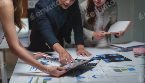 Preview: Business professionals analyzing data and discussing strategy