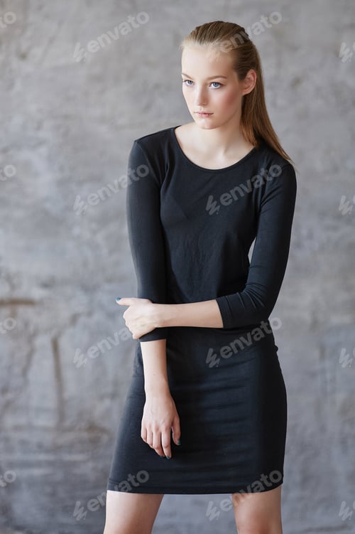Preview: A woman in a black dress.