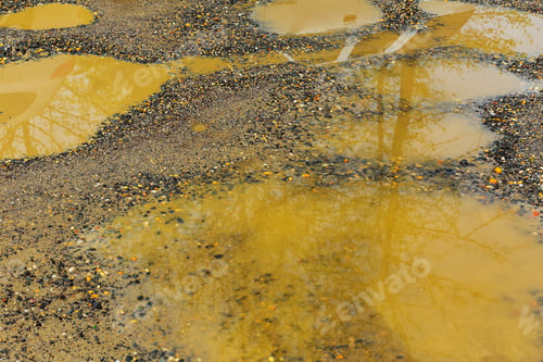 Preview: The texture of the mud or wet soil along a country road after rain