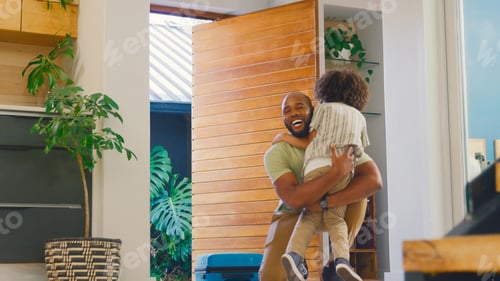 Preview: Son Greeting Father Returning Home With Luggage From Trip Away