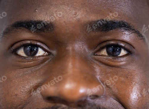 Preview: Unaltered portrait of eyes of happy african american male doctor smiling