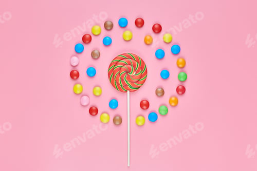 Preview: Sweet lollipop and candy on pink background