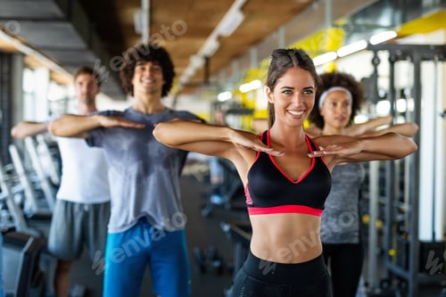 Preview: Group of young people, friends smiling and enjoy sport in gym. People exercise, work out concept.