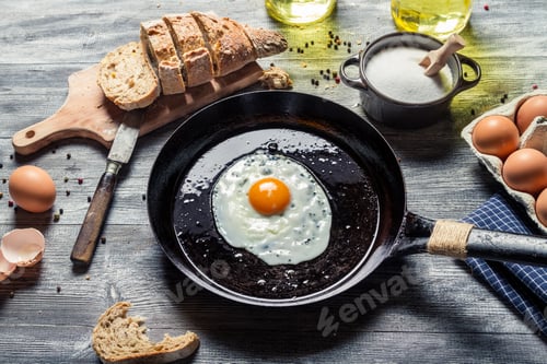 Preview: Egg served with bread on a pan in countryside