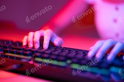 Preview: Hand on keyboard in professional cyber video gamer studio room
