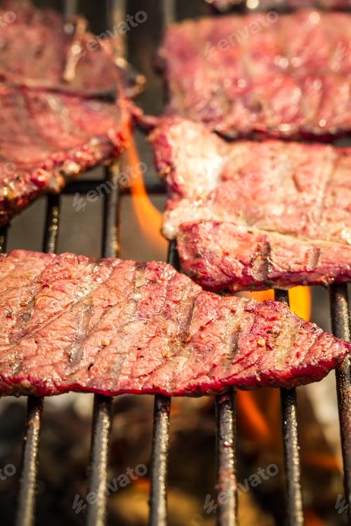 Preview: Closeup of steak on grill fire-toasted