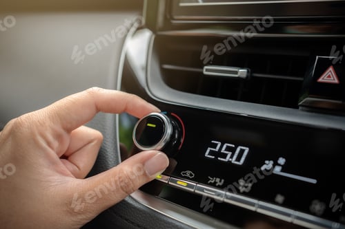 Preview: Driver adjusting car air conditioner system at interior panel