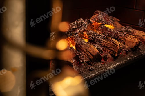 Preview: Close up of a fireplace with burning wood logs inside