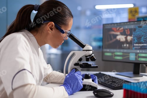 Preview: Microbiologist doctor analyzing dna sample using medical microscope