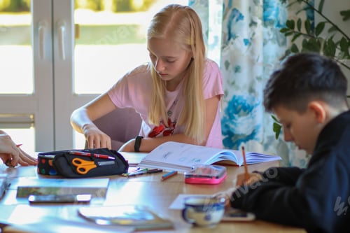 Preview: Children at home at the table do their homework, paint pictures, crafts, crafting, family at home.