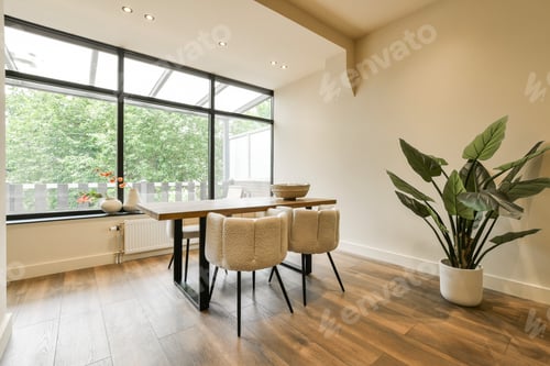 Preview: a dining room with a large window and a table