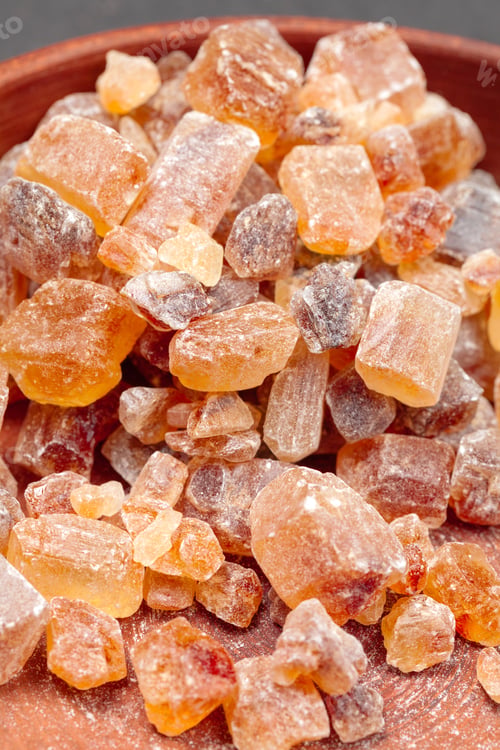 Preview: brown sugar rock organic crystalline close up on dark background