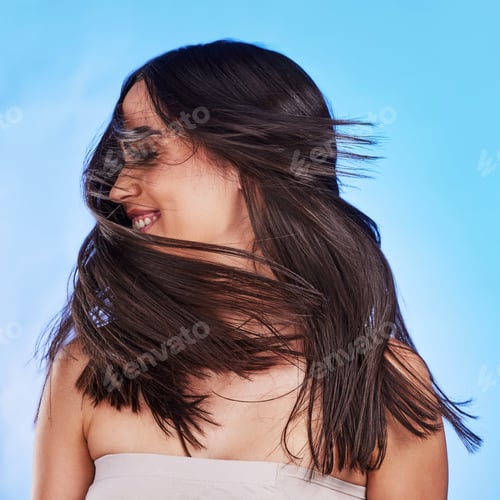 Preview: Woman, shake hair and beauty with shine, volume and texture against a blue studio background. Natur
