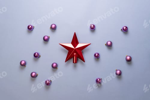 Preview: a red shiny christmas star with balls flat lay, abstract layout