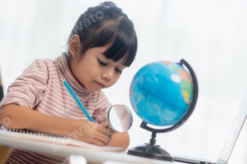 Preview: Asian little girl is learning the globe model, concept of save the world and learn