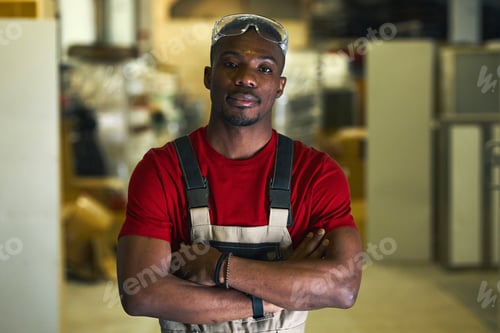 Preview: Worker In Uniform Working In Factory