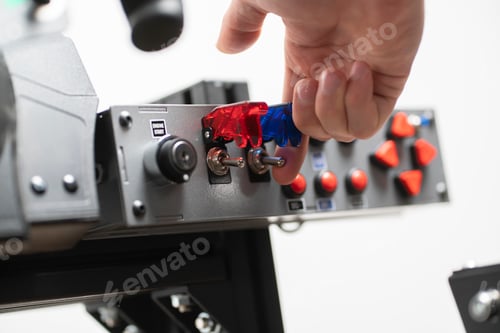 Preview: a worker turning on the toggle switch up, industrial power control panel