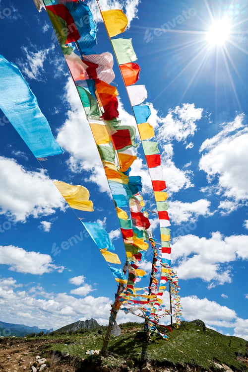 Preview: Rows of colourful prayer flags against blue sky, Zhagana, Gansu, China