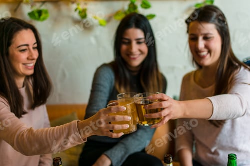 Preview: Happy friends group drinking beer at brewery bar restaurant