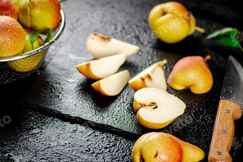 Preview: Sliced ripe pear with a knife.