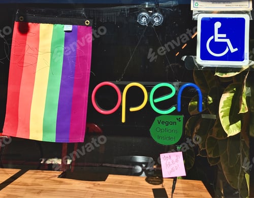 Preview: Restaurant window front displaying a rainbow flag 🏳️🌈 rainbow lighted open sign