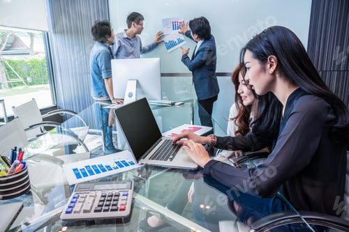 Preview: Group Of Asian Business people with casual suit working and talking together in the modern Office
