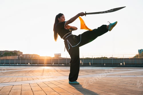 Preview: Chinese young woman practicing wushu kung fu.