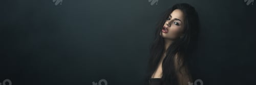 Preview: Portrait of a Woman on a Dark Wide Banner with Copy Space